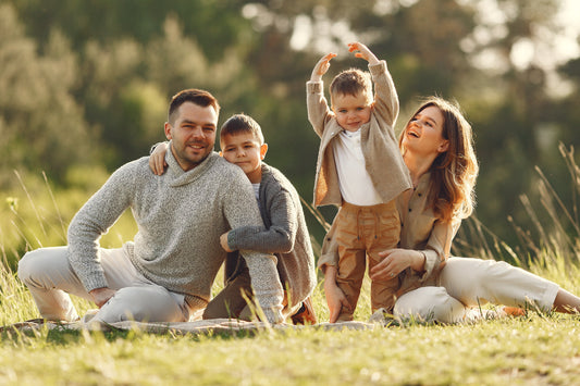Happy family enjoying sunlight outdoors representing healthy lifestyle and the role of zinc in supporting immunity and overall well-being