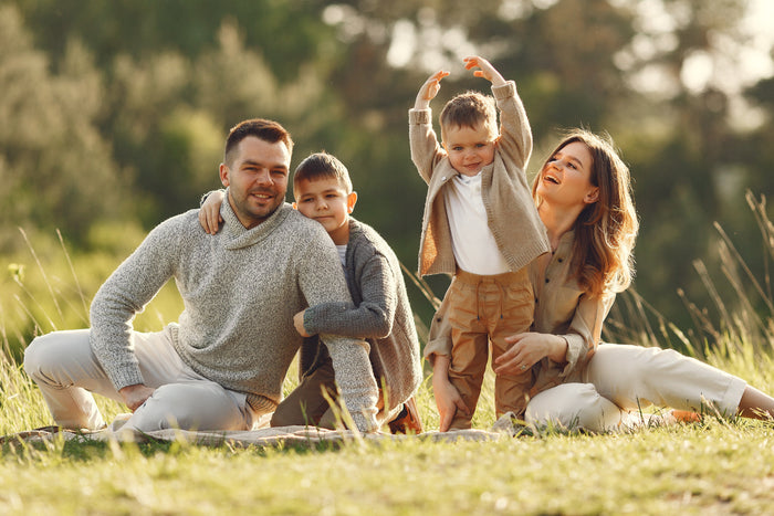 Happy family enjoying sunlight outdoors representing healthy lifestyle and the role of zinc in supporting immunity and overall well-being