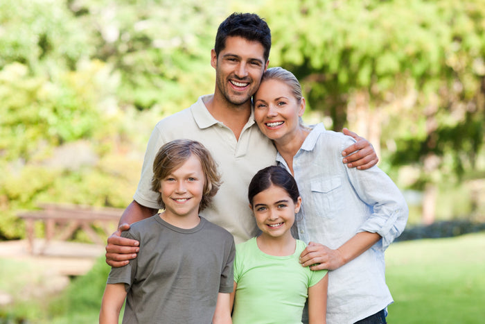 Happy family enjoying outdoor winter wellness activities to support immune health and stay active in February