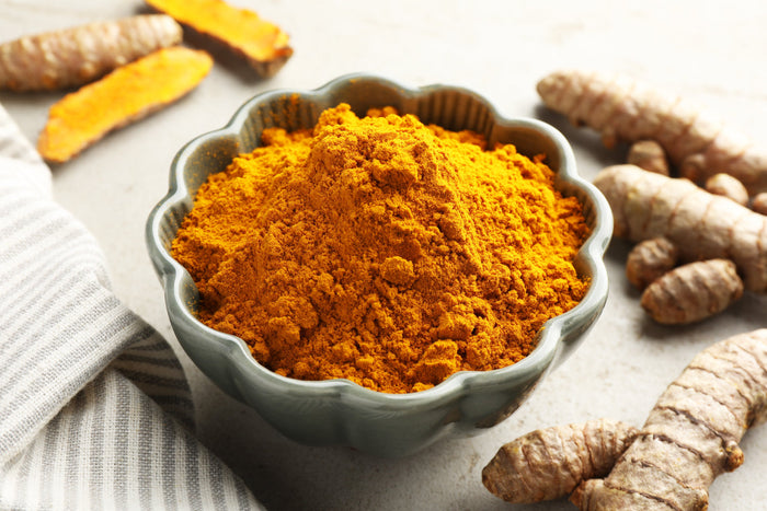 Ground turmeric powder rich in curcumin used to support healthy joints and reduce winter stiffness