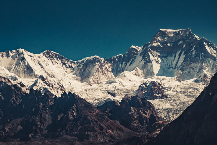 Snow-covered Himalayan mountains where shilajit naturally forms, symbolizing mineral-rich environments linked to traditional vitality practices.
