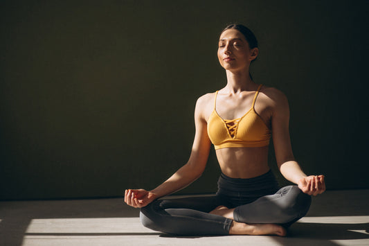 Woman meditating calmly to support stress reduction and improve overall health and nutrient balance