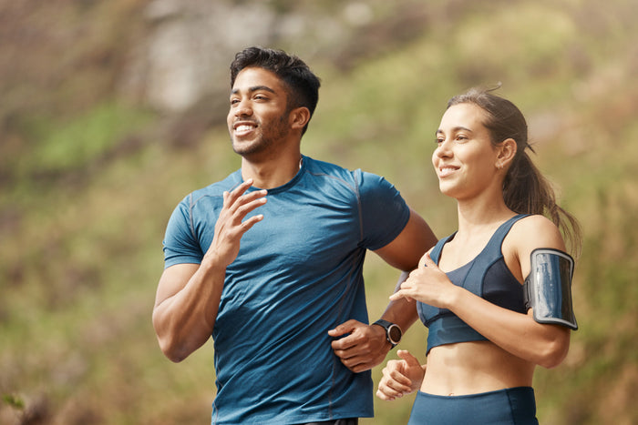 Healthy couple jogging outdoors, symbolizing strong immunity, energy, and winter wellness supported by essential nutrients like zinc.