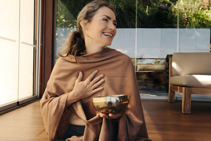 Woman practicing mindful meditation inspired by Ayurvedic lifestyle for inner peace and balance.